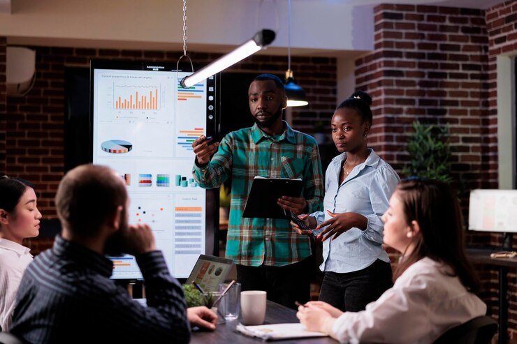 african-american-work-colleagues-brainstorming-marketing-strategy-with-sales-team-working-overtime-late-night-meeting-two-coworkers-discussing-business-ideas-w